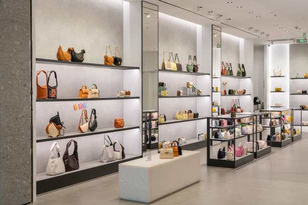Luxury handbag boutique with curated display shelving