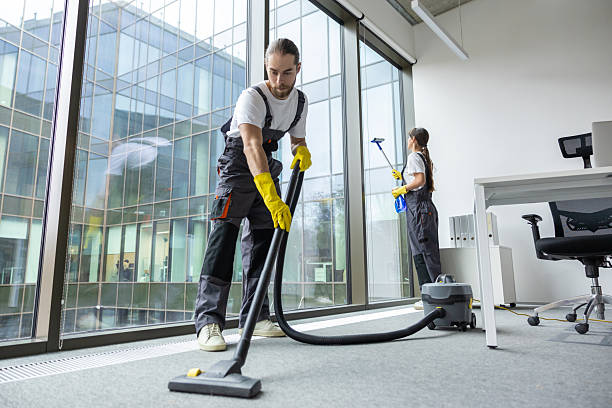 Cleaners servicing a modern office after hours